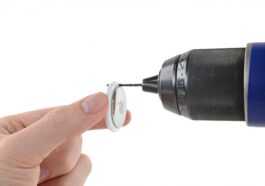 iFixit shows you can drill a key ring hole in an AirTag without breaking it