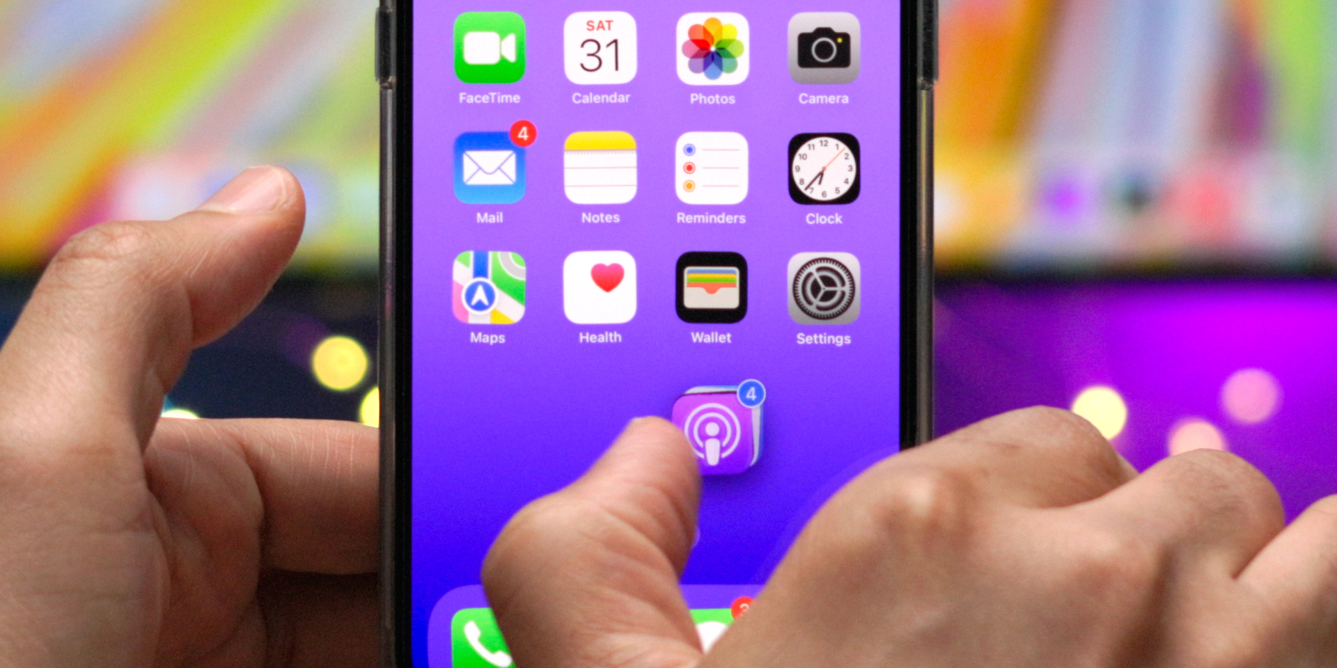 Cours de maître sur l'écran d'accueil iOS 16 : 85 trucs, astuces et fonctionnalités cachées - les connaissez-vous tous ? Déplacement de quatre icônes d'application sur l'écran d'accueil dans iOS 16 en mode édition.