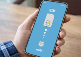 Male,hand,holding,phone,with,sim,card,replacement,on,esim