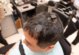 Brain implants powered by AI help paralyzed man feel and move again