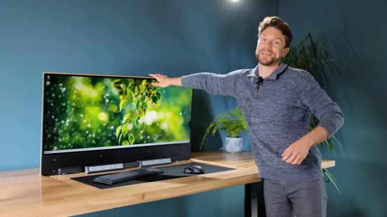 Ce bureau cache un PC de jeu complet, une RTX 4090 et un moniteur OLED grand écran inclus 1 This desk hides a full gaming PC, RTX 4090, and widescreen OLED monitor included