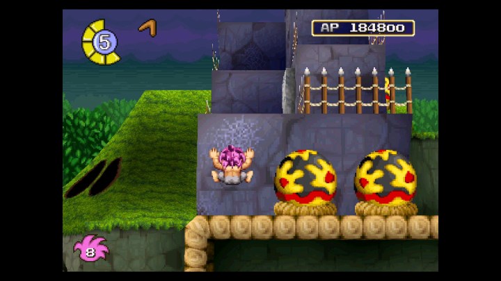 Vous devez jouer à ce classique sous-estimé de la PS1 sur Nintendo Switch 3 Tomba grimpe un mur dans Tomba! Special Edition.