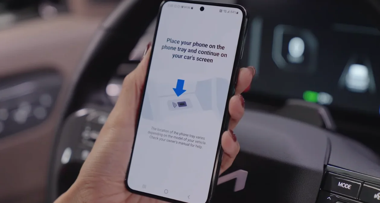 Instruction de placer le téléphone sur le plateau
