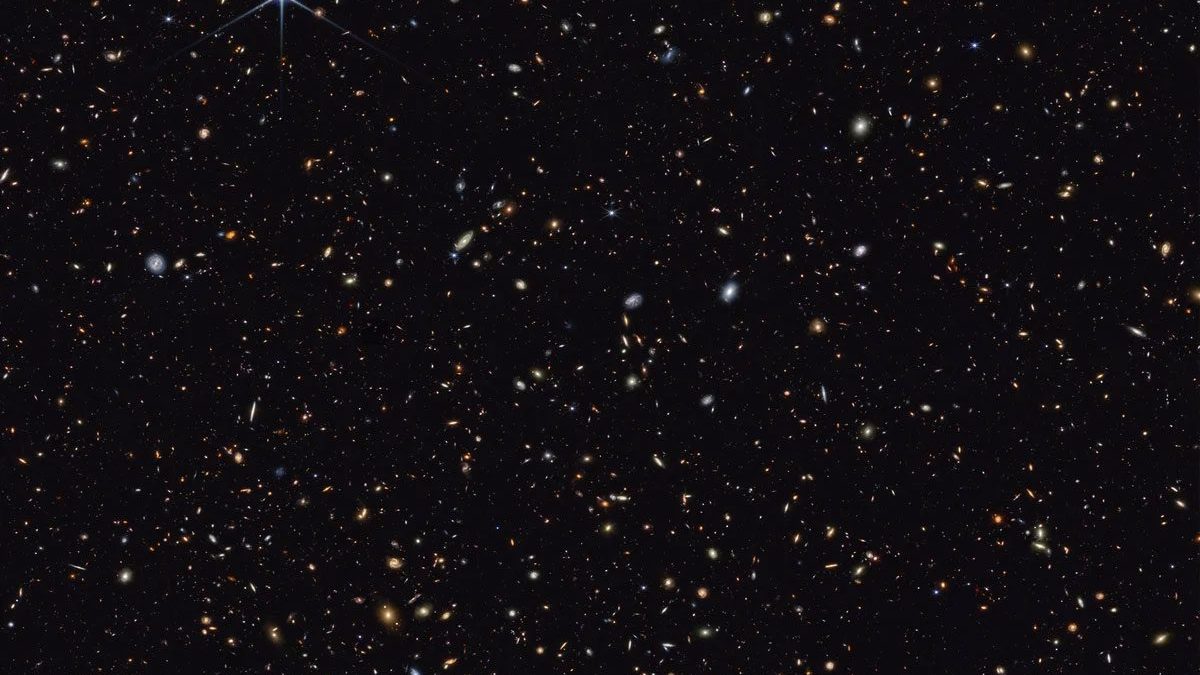 Le télescope James Webb découvre 300 galaxies qui défient la science : "Elles pourraient transformer notre compréhension du cosmos" 2 Les galaxies les plus distantes jamais photographiées par le JWST apparaissent comme de petites taches rougeâtres dans l'image qui combine les données des caméras MIRI et NIRCam du JWST. Crédits : NASA/ESA/CSA/STScI